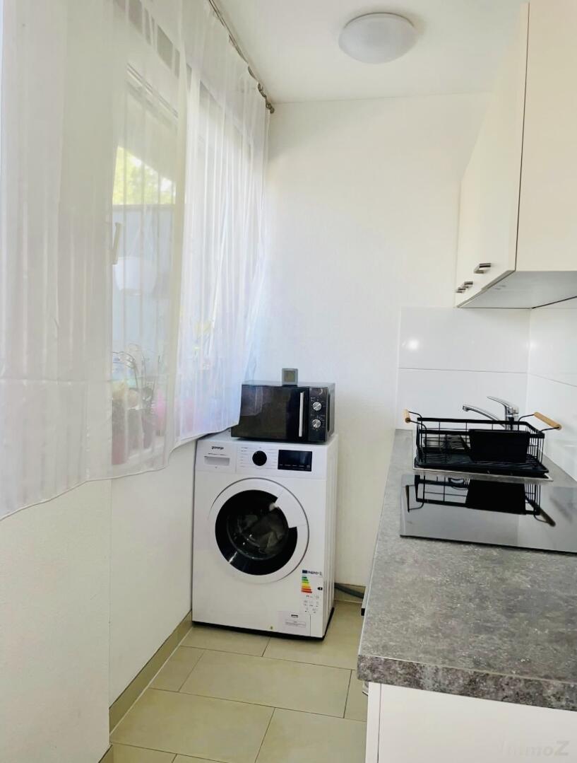 Wohnung zu kaufen: 6175 Kematen - Küche mit Waschmaschine